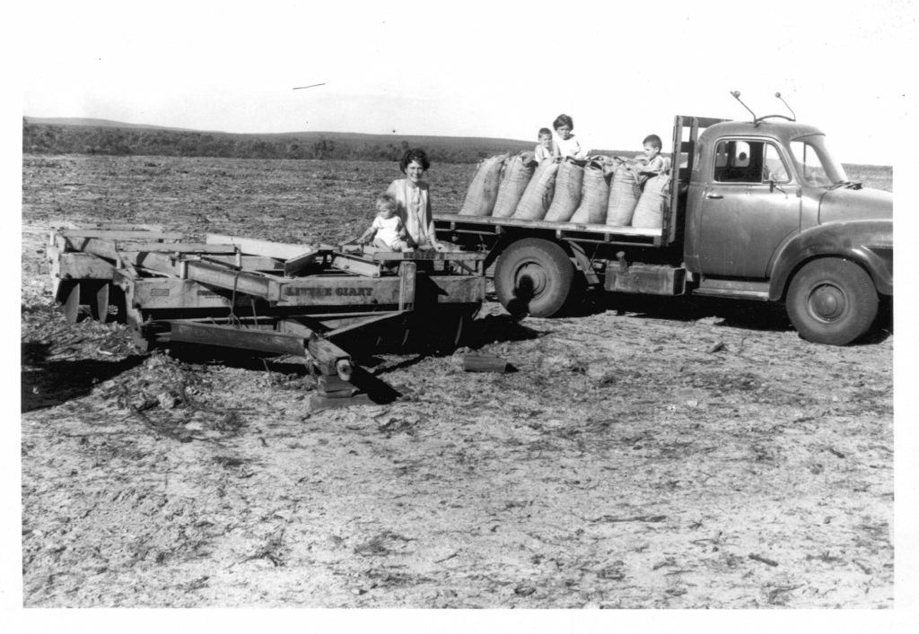 Image of Pattie Leighton and Sylvia, Jim, Penny and Sam with the first delivery of superphosphate to Wilyun Pools Farm, 1966.